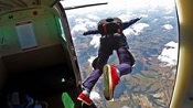 A skydiver jumps out of a plane